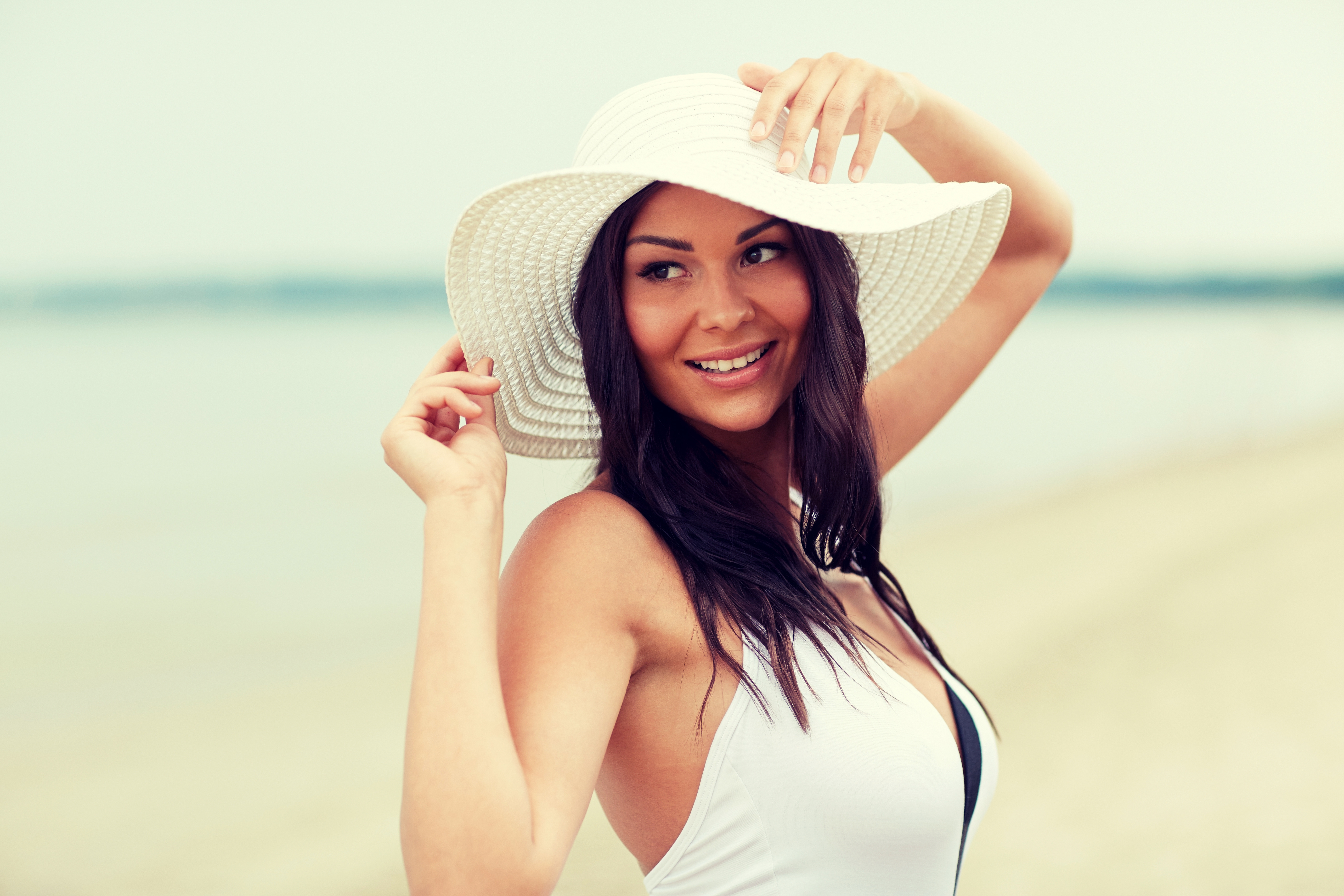 How to have a happy face - Plastic Surgery and beauty tips Breast Augmentation Surgery can give women the confidence to go to the beach and wear a bikini.